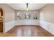 Formal dining room with hardwood floors and wainscoting at 4684 Pine Dr, Loganville, GA 30052