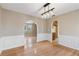 Dining room with hardwood floors, an archway, and views into adjacent rooms at 4684 Pine Dr, Loganville, GA 30052