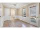 Tiled dining area with access to bathroom and backyard at 4684 Pine Dr, Loganville, GA 30052