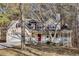 Two-story house with a wraparound porch and attached garage at 4684 Pine Dr, Loganville, GA 30052