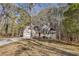 Two-story house with a wraparound porch and attached garage at 4684 Pine Dr, Loganville, GA 30052