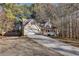 Two-story house with a long driveway and attached garage at 4684 Pine Dr, Loganville, GA 30052