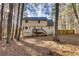 Back of house with deck and surrounding trees at 4684 Pine Dr, Loganville, GA 30052