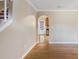 Spacious living room with hardwood floors and a fireplace at 4684 Pine Dr, Loganville, GA 30052