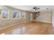 Bright living room with hardwood floors, large windows, and a view of the backyard at 4684 Pine Dr, Loganville, GA 30052