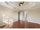 Main bedroom with hardwood floors and access to bathroom at 4684 Pine Dr, Loganville, GA 30052
