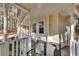 Wraparound porch with white railings and wooden floor at 4684 Pine Dr, Loganville, GA 30052