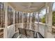 Screened porch with wooded views and seating for two at 4684 Pine Dr, Loganville, GA 30052