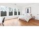 Bright bedroom with hardwood floors, multiple windows, and a neutral color palette at 500 Covington Cv, Alpharetta, GA 30022