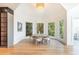 Elegant dining area with a round table and chairs, bathed in natural light at 500 Covington Cv, Alpharetta, GA 30022