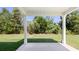 Covered patio with grassy backyard view at 652 Kimberwick Dr, Locust Grove, GA 30248