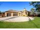 Stunning brick home featuring a circular driveway, manicured lawn, and a three-car garage at 1762 Patrick Rd, Dacula, GA 30019