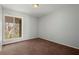 Spacious bedroom with neutral walls and brown carpet at 3301 Henderson Mill Rd # A2, Atlanta, GA 30341