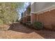 Brick townhouses with landscaping and a walkway at 3301 Henderson Mill Rd # A2, Atlanta, GA 30341
