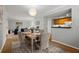 Dining room with wood table and chairs, kitchen view at 3301 Henderson Mill Rd # A2, Atlanta, GA 30341