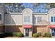 Inviting brick front exterior of townhome with landscaping at 3301 Henderson Mill Rd # A2, Atlanta, GA 30341
