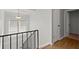 Upstairs hallway with neutral walls and wood floors at 3301 Henderson Mill Rd # A2, Atlanta, GA 30341