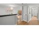 Bright hallway with wood floors and access to balcony at 3301 Henderson Mill Rd # A2, Atlanta, GA 30341