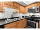 Kitchen features stainless steel appliances and wood cabinets at 3301 Henderson Mill Rd # A2, Atlanta, GA 30341