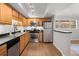 Modern kitchen with stainless steel appliances and wood cabinets at 3301 Henderson Mill Rd # A2, Atlanta, GA 30341