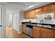 Modern kitchen with stainless steel appliances and wood cabinets at 3301 Henderson Mill Rd # A2, Atlanta, GA 30341