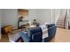 Living room with wood floors, blue couch, and large art at 3301 Henderson Mill Rd # A2, Atlanta, GA 30341