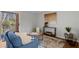 Living room with wood floors, blue couch, and large art at 3301 Henderson Mill Rd # A2, Atlanta, GA 30341