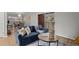 Living area with blue sofa and view of dining area at 3301 Henderson Mill Rd # A2, Atlanta, GA 30341