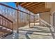 Stone patio with wooden stairs, offering a serene view of the wooded backyard at 820 Hillcrest Ln, Woodstock, GA 30189