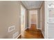 Hardwood floor hallway with access to bathroom and other rooms at 1021 Magnolia Se Dr, Smyrna, GA 30082