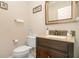 Small powder room with granite vanity and single sink at 2983 Rivergreen Ln, Atlanta, GA 30339