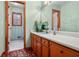 Clean bathroom with wood cabinets and updated sink at 3985 W Stubbs Rd, Atlanta, GA 30349