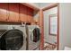 Laundry room with washer, dryer, and built-in cabinets at 3985 W Stubbs Rd, Atlanta, GA 30349