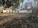 Spacious backyard featuring a detached garage, offering ample space for outdoor activities at 5039 East St, Forest Park, GA 30297