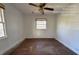 Simple bedroom with hardwood floors and a window at 5039 East St, Forest Park, GA 30297