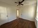 Bedroom with hardwood floors and access to another room at 5039 East St, Forest Park, GA 30297