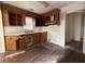 Kitchen features wood cabinets and vinyl flooring at 5039 East St, Forest Park, GA 30297