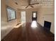 Living room featuring hardwood floors, fireplace, and sunlit view at 5039 East St, Forest Park, GA 30297