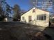Side view of a cozy home with a small, detached shed and a paved area at 5039 East St, Forest Park, GA 30297
