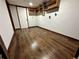 Finished basement room with dark wood-look floors and built-in shelving at 7035 Stone Wood Nw Dr, Kennesaw, GA 30152