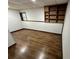 Spacious finished basement with new flooring and built-in shelving at 7035 Stone Wood Nw Dr, Kennesaw, GA 30152