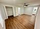 Main bedroom with ceiling fan, walk-in closet, and en-suite bathroom at 7035 Stone Wood Nw Dr, Kennesaw, GA 30152