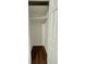 Empty closet with white shelving and dark brown luxury vinyl plank flooring at 7035 Stone Wood Nw Dr, Kennesaw, GA 30152