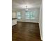 Bright dining room with hardwood floors and a chandelier at 7035 Stone Wood Nw Dr, Kennesaw, GA 30152