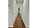 Light and bright hallway with dark brown luxury vinyl plank flooring at 7035 Stone Wood Nw Dr, Kennesaw, GA 30152