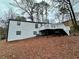 White siding and black trim on house exterior at 7035 Stone Wood Nw Dr, Kennesaw, GA 30152