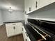 Modern kitchen features white shaker cabinets, black countertops, and a large island at 7035 Stone Wood Nw Dr, Kennesaw, GA 30152