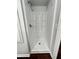 Clean white shower stall in the basement bathroom at 7035 Stone Wood Nw Dr, Kennesaw, GA 30152