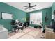 Home office with teal walls, built in shelving and two work stations at 1170 Rose Terrace Cir, Loganville, GA 30052