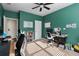 Home office with teal walls, built in shelving and two work stations at 1170 Rose Terrace Cir, Loganville, GA 30052